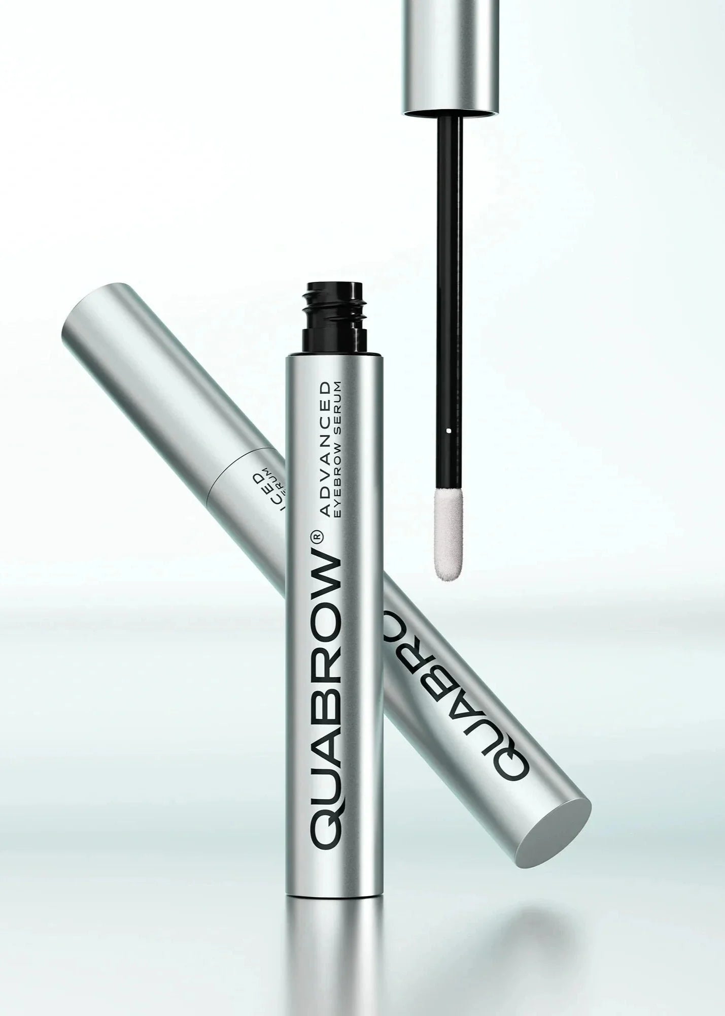QUABROW Advanced Eyebrow Serum 3.5 ml with open applicator in a clean, minimalist composition