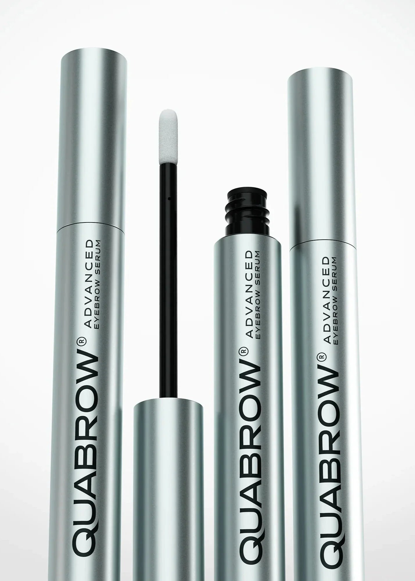 Close-up of QUABROW Trio Set showing three serum tubes with visible soft applicator tips
