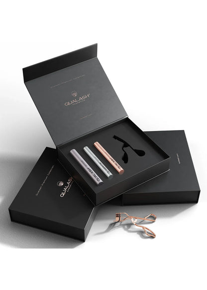 Stylish lifestyle photo of Qualash Premium Collection with curler and product packaging