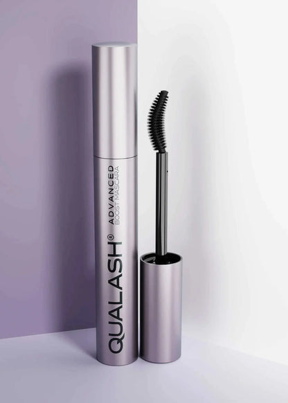 QUALASH Advanced Mascara Curl &amp; Lift 10 ml with curved brush standing upright against a soft lilac and white background